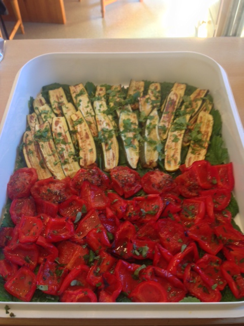 Baked zucchinis with fresh mint, baked peppers with fresh oregano on lemon balm leaves