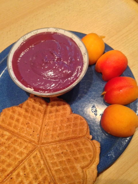 Breakfast with waffle, blueberry cream and apricots