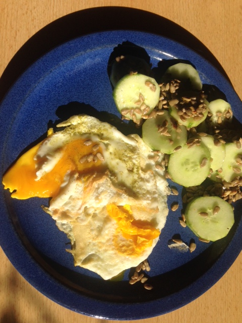 Cucumber salad with fried egg