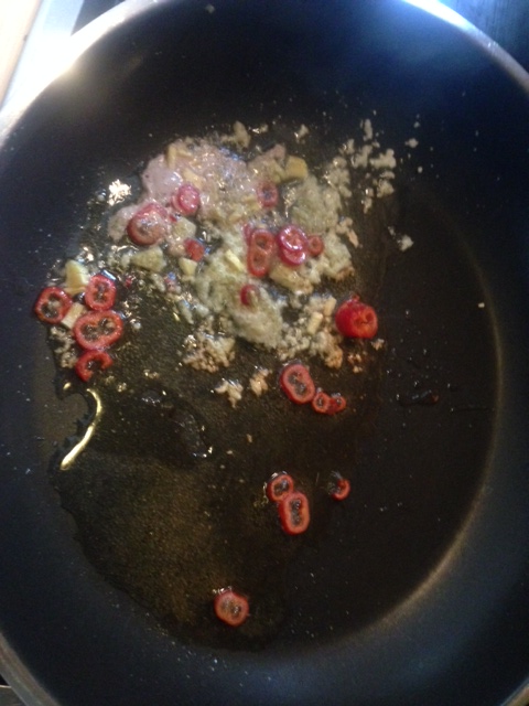 Fry the garlic, ginger and peppers in oil