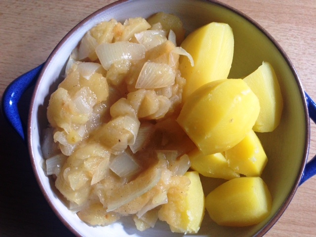 Boiled potatoes with apple and onion vegetables or heaven and earth